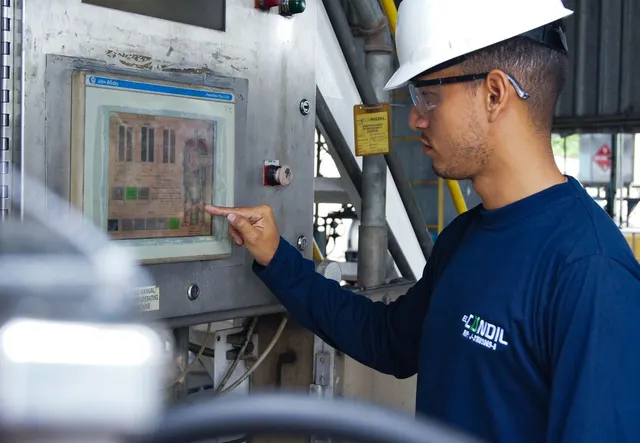 Engineer working at control room desk