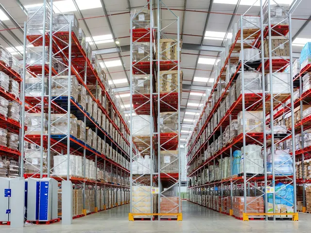 Warehouse racking stacked with stored cartons